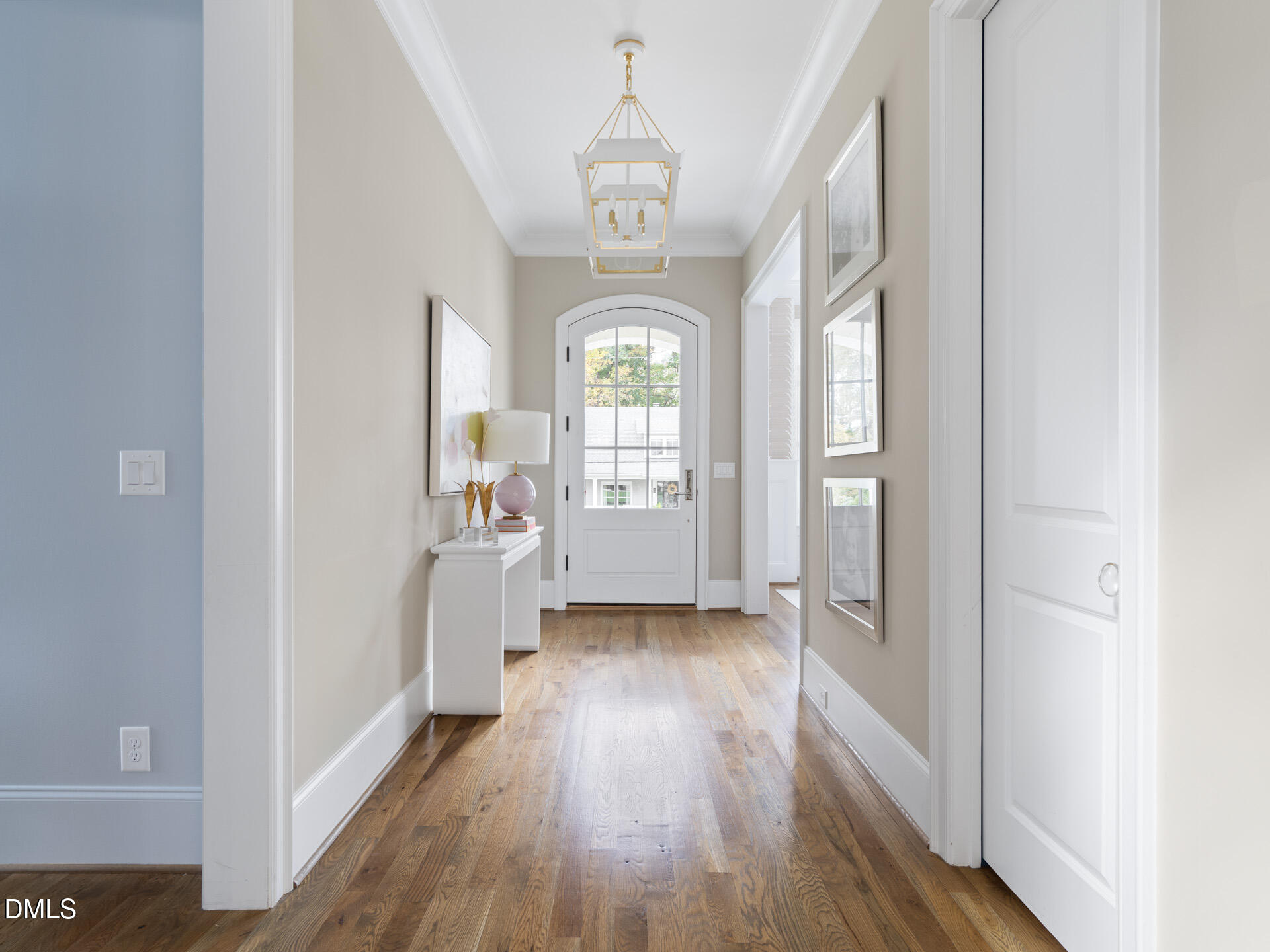 2820 Claremont Road Raleigh, NC 27608 - Photo 2 of 60 The home welcomes you with a beautiful foyer and custom lighting.