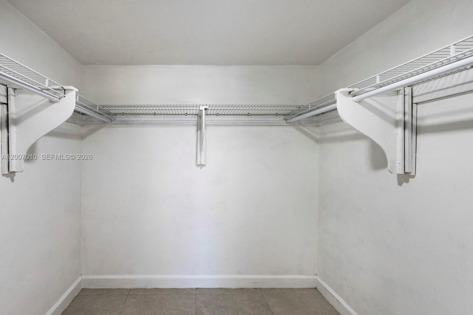 10855 Southwest 112th Avenue, Unit 211 Miami, FL 33176 - Photo 11 of 23 a view of a room with racks on the wall