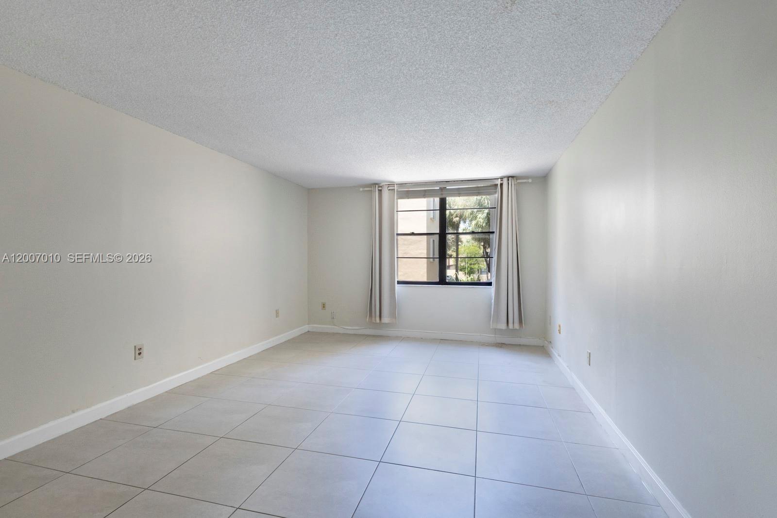 10855 Southwest 112th Avenue, Unit 211 Miami, FL 33176 - Photo 12 of 23 an empty room with windows