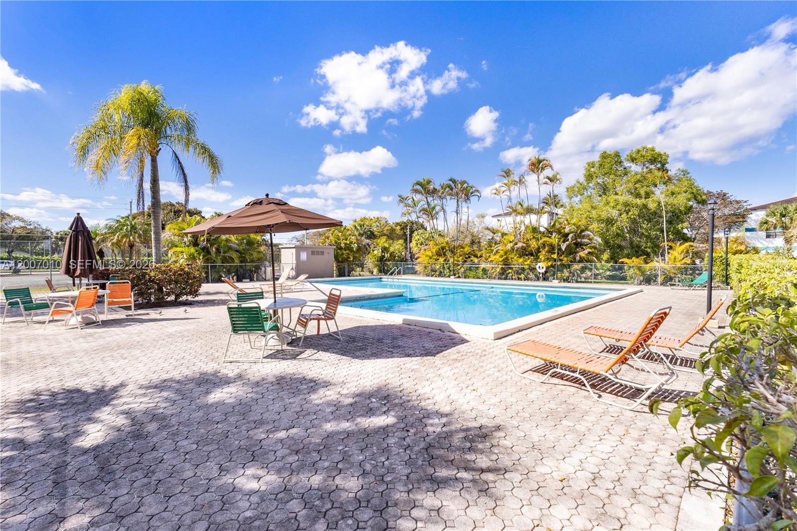 10855 Southwest 112th Avenue, Unit 211 Miami, FL 33176 - Photo 18 of 23 a view of a basket ball with an umbrella
