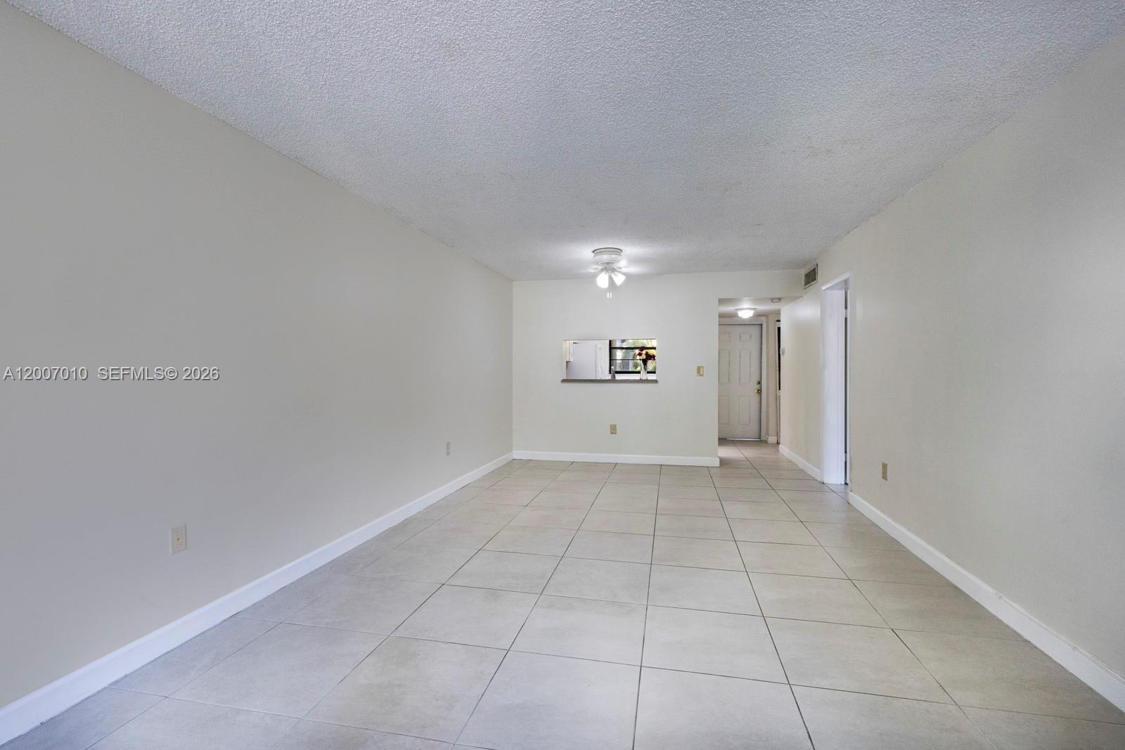 10855 Southwest 112th Avenue, Unit 211 Miami, FL 33176 - Photo 19 of 23 a view of a livingroom with an empty space