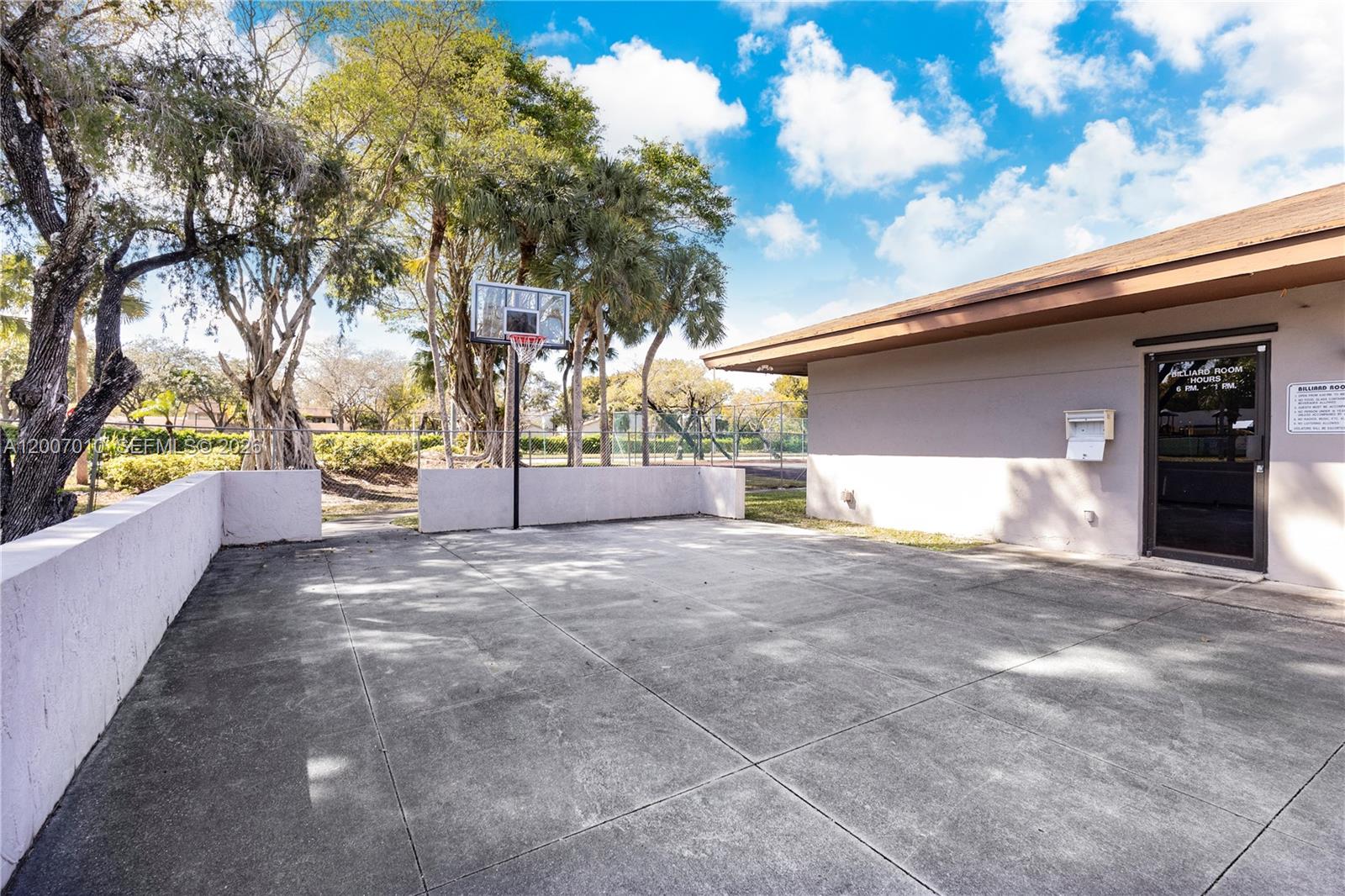 10855 Southwest 112th Avenue, Unit 211 Miami, FL 33176 - Photo 22 of 23 a view of garage and deck