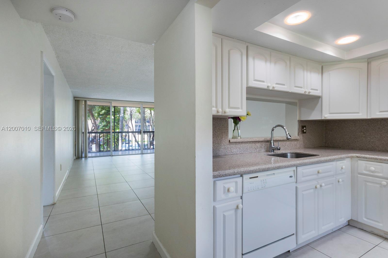 10855 Southwest 112th Avenue, Unit 211 Miami, FL 33176 - Photo 3 of 23 a kitchen with a sink and cabinets