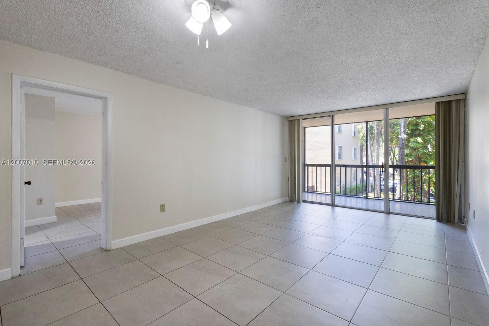 10855 Southwest 112th Avenue, Unit 211 Miami, FL 33176 - Photo 7 of 23 a view of an empty room with a window