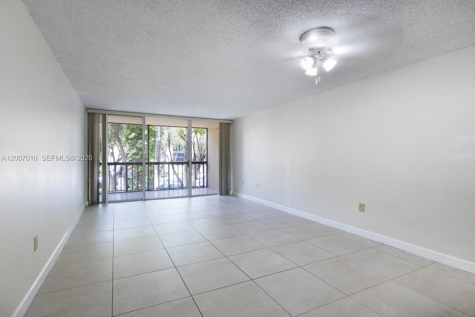 10855 Southwest 112th Avenue, Unit 211 Miami, FL 33176 - Photo 8 of 23 a view of an empty room with a window