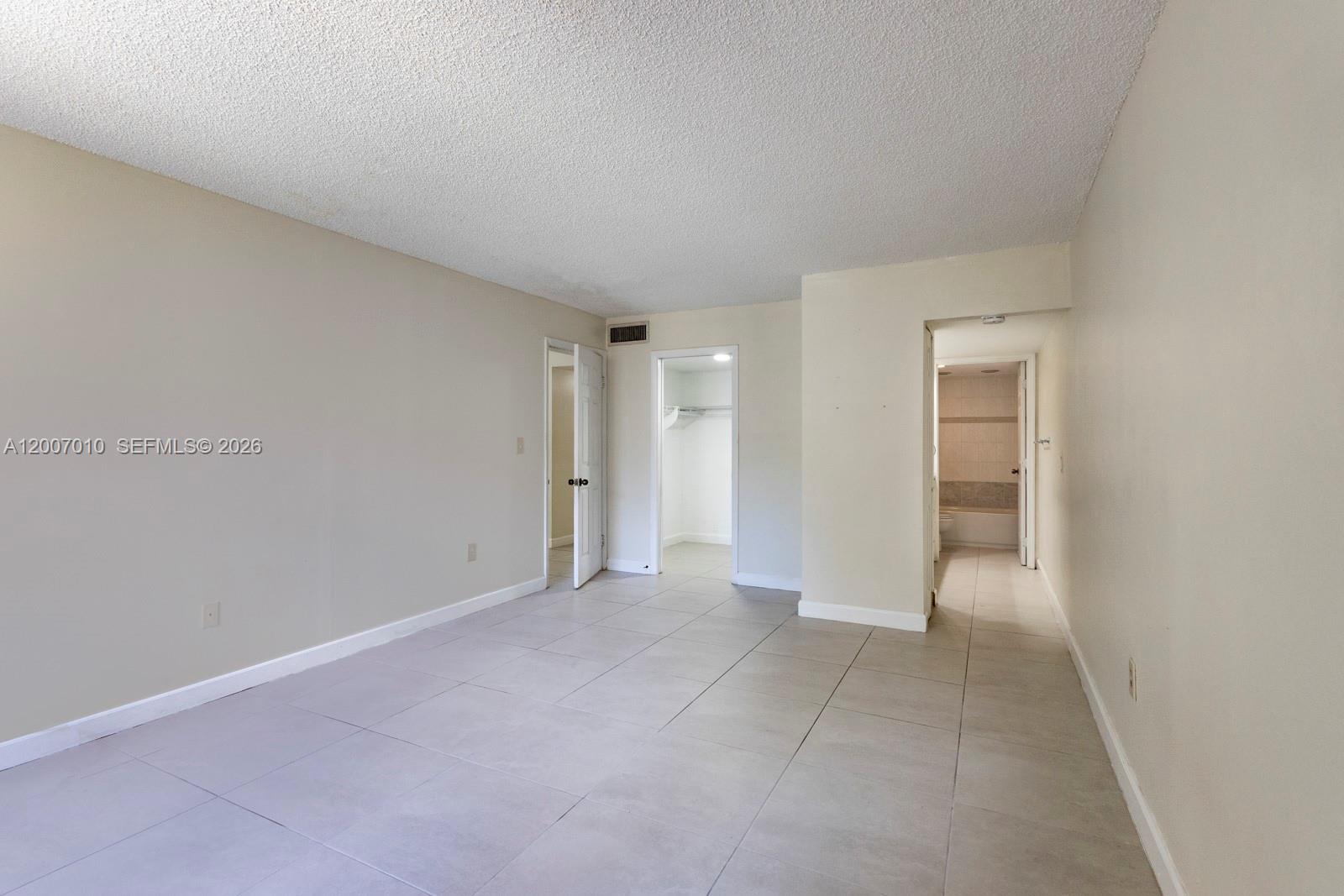10855 Southwest 112th Avenue, Unit 211 Miami, FL 33176 - Photo 9 of 23 a view of an empty room and closet