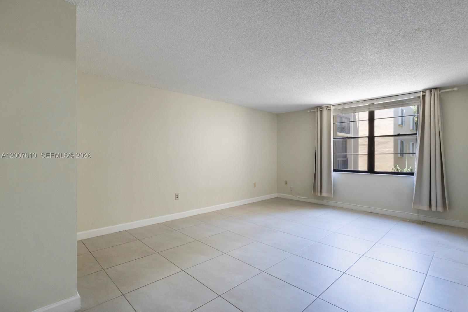 10855 Southwest 112th Avenue, Unit 211 Miami, FL 33176 - Photo 10 of 23 an empty room with windows