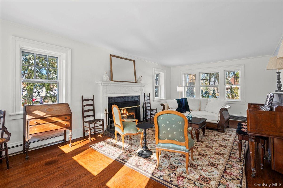 525 Milton Road Rye, NY 10580 - Photo 13 of 31 Living room with a glass covered fireplace, and plenty of natural light