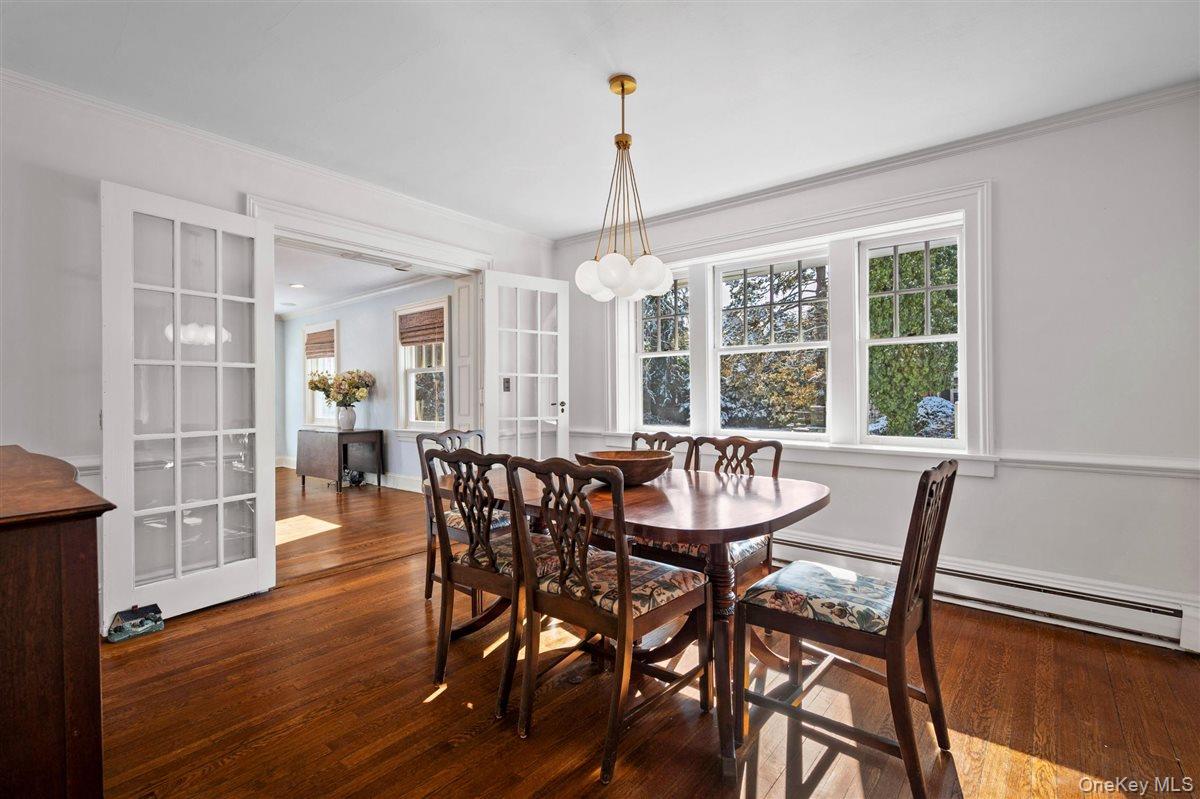 525 Milton Road Rye, NY 10580 - Photo 7 of 31 Dining room with french doors, healthy amount of natural light and ornamental molding,