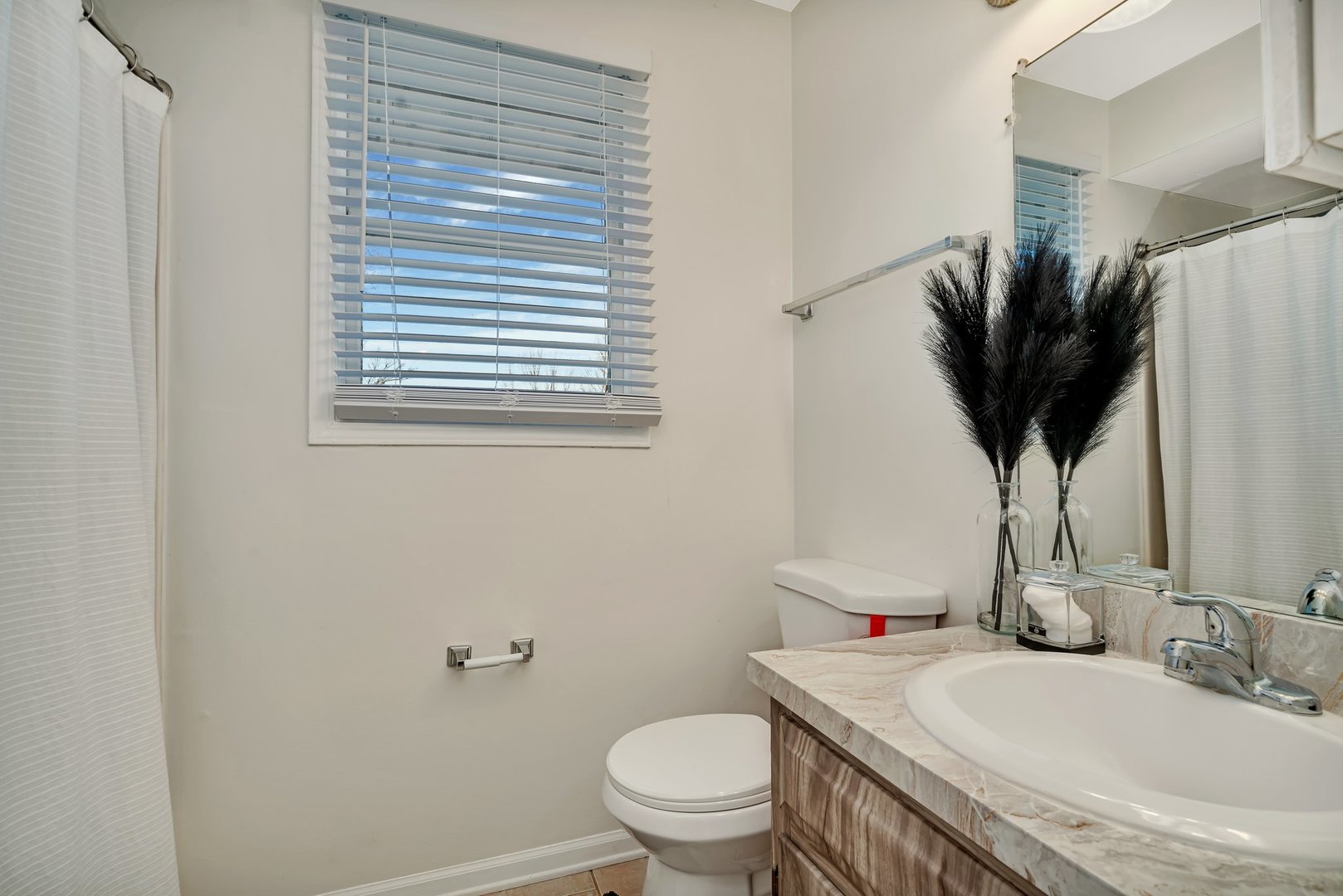 403 South Raven Road Shorewood, IL 60404 - Photo 15 of 24 a bathroom with a granite countertop sink a toilet and a mirror