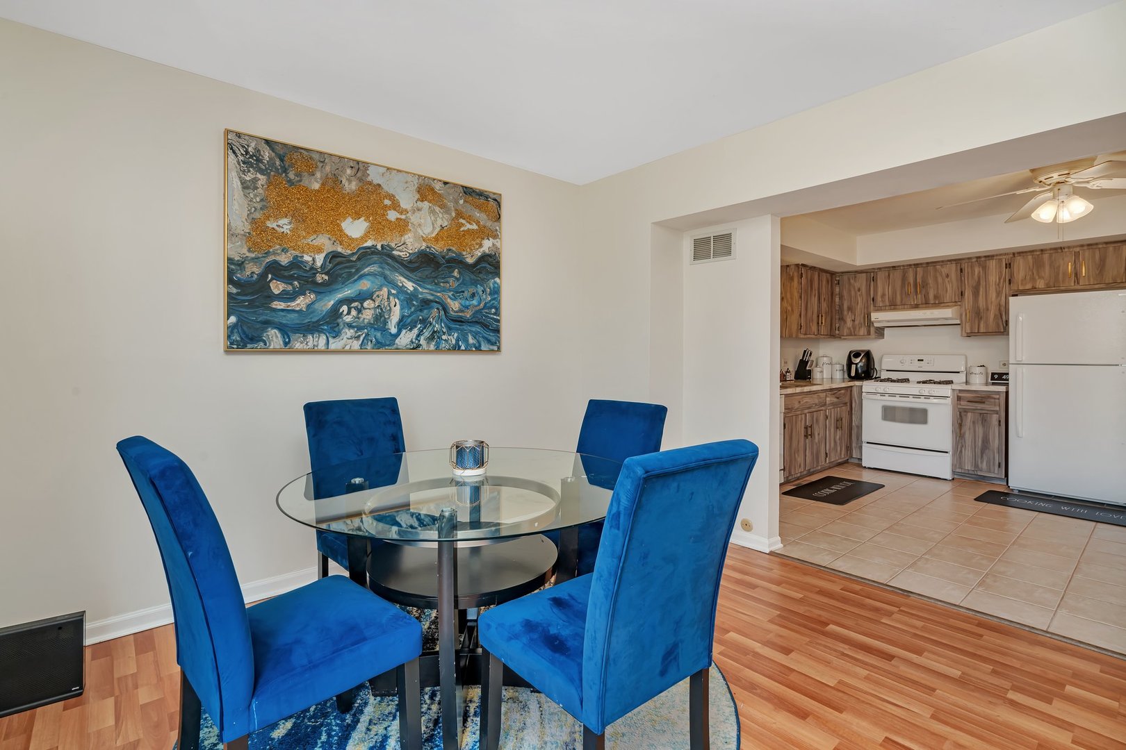 403 South Raven Road Shorewood, IL 60404 - Photo 7 of 24 a view of a dining room with furniture wooden floor and a kitchen view