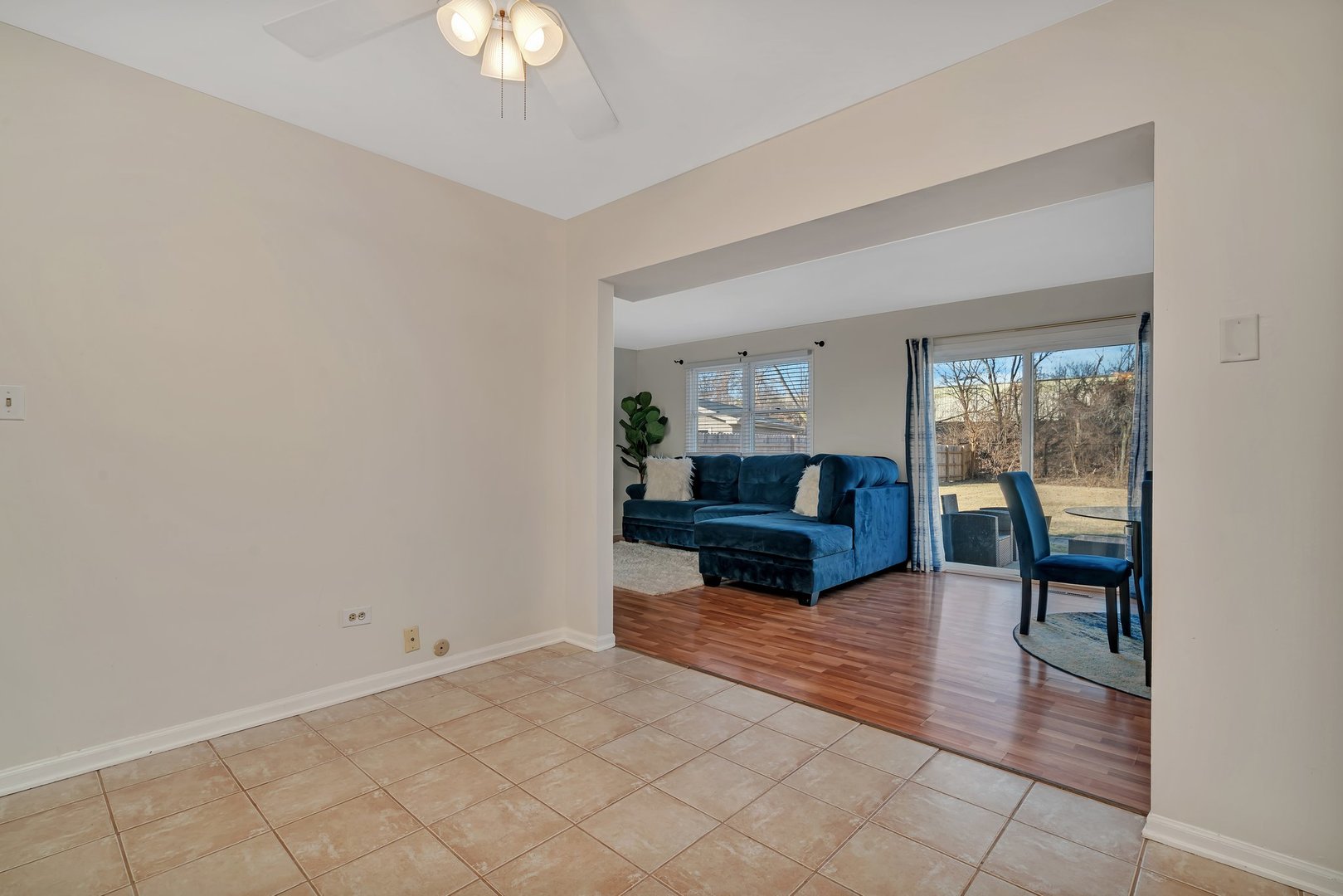 403 South Raven Road Shorewood, IL 60404 - Photo 8 of 24 a living room with furniture a lamp and a potted plant