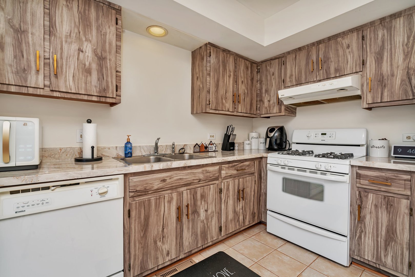 403 South Raven Road Shorewood, IL 60404 - Photo 10 of 24 a kitchen with stainless steel appliances granite countertop a sink and cabinets