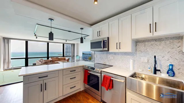 a kitchen with stainless steel appliances granite countertop a sink and cabinets