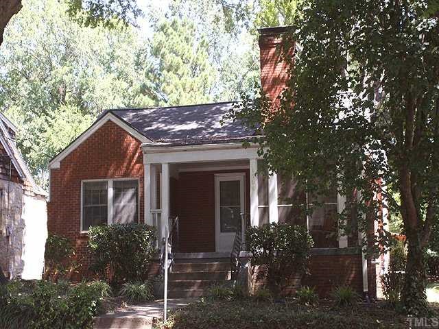 a view of house with a tree in front of it