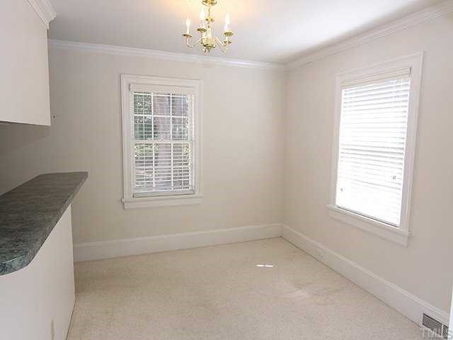 1508 Fairview Road Raleigh, NC 27608 - Photo 3 of 12 an empty room with windows