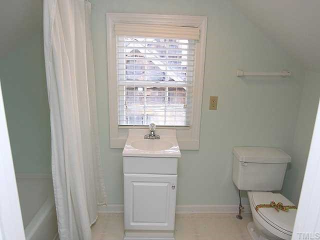 1508 Fairview Road Raleigh, NC 27608 - Photo 8 of 12 a bathroom with a sink toilet and a window