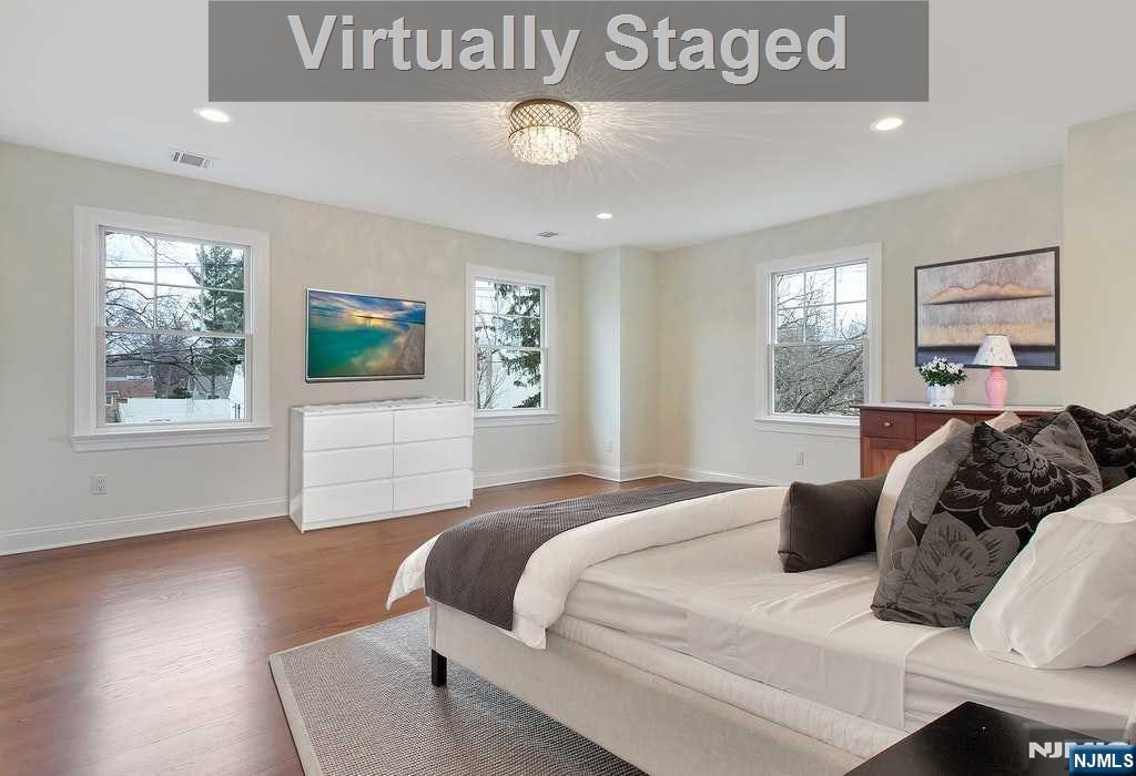 582 Green Valley Road Paramus, NJ 07652 - Photo 13 of 25 a bedroom with a bed and a night stand