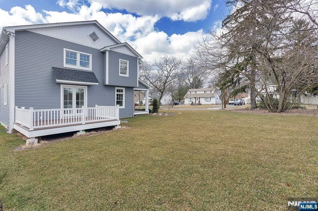 582 Green Valley Road Paramus, NJ 07652 - Photo 24 of 25 a front view of a house with a garden