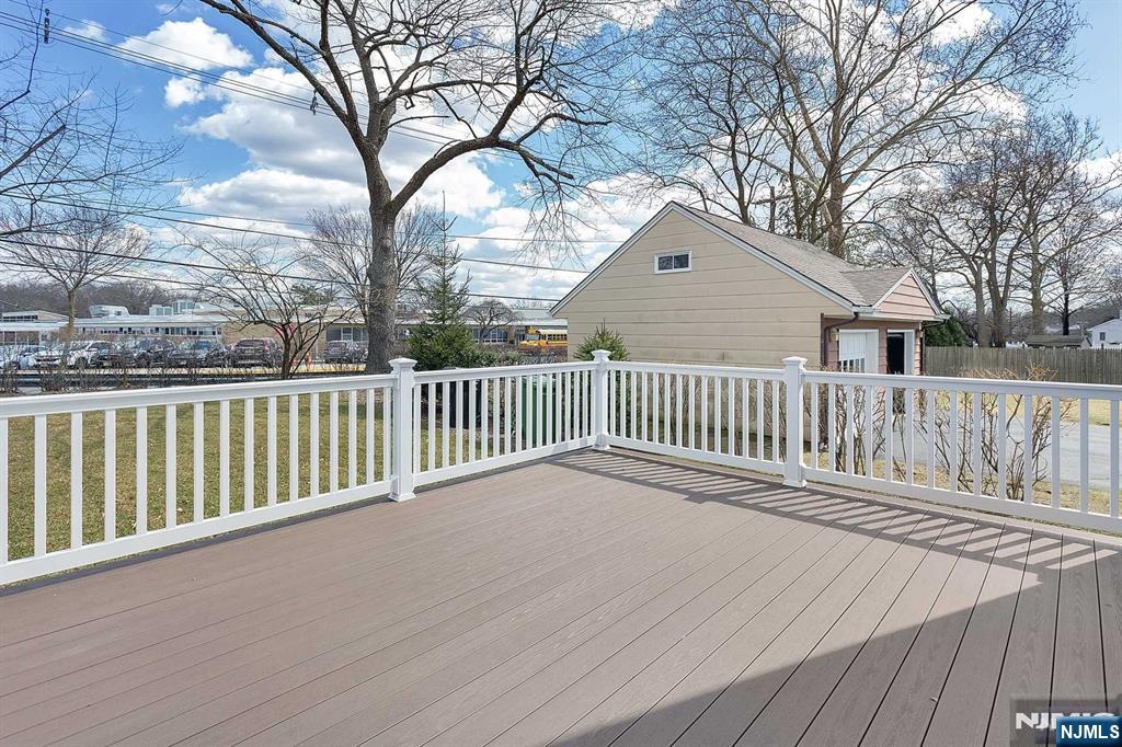 582 Green Valley Road Paramus, NJ 07652 - Photo 25 of 25 a view of a wooden deck and a yard