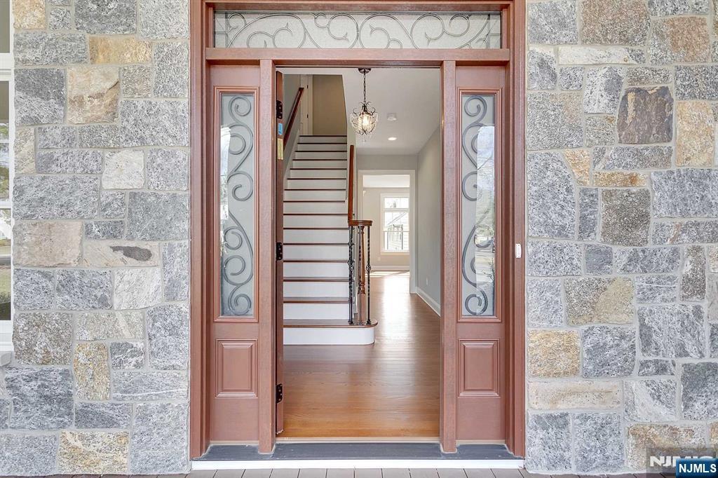 582 Green Valley Road Paramus, NJ 07652 - Photo 3 of 25 a view of a hallway with wooden door