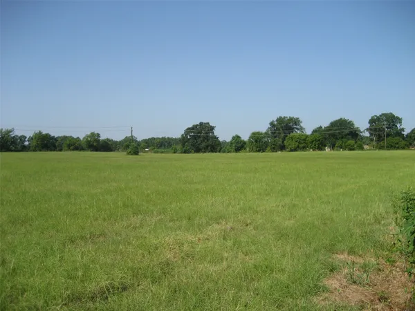 a view of a field with an outdoor space