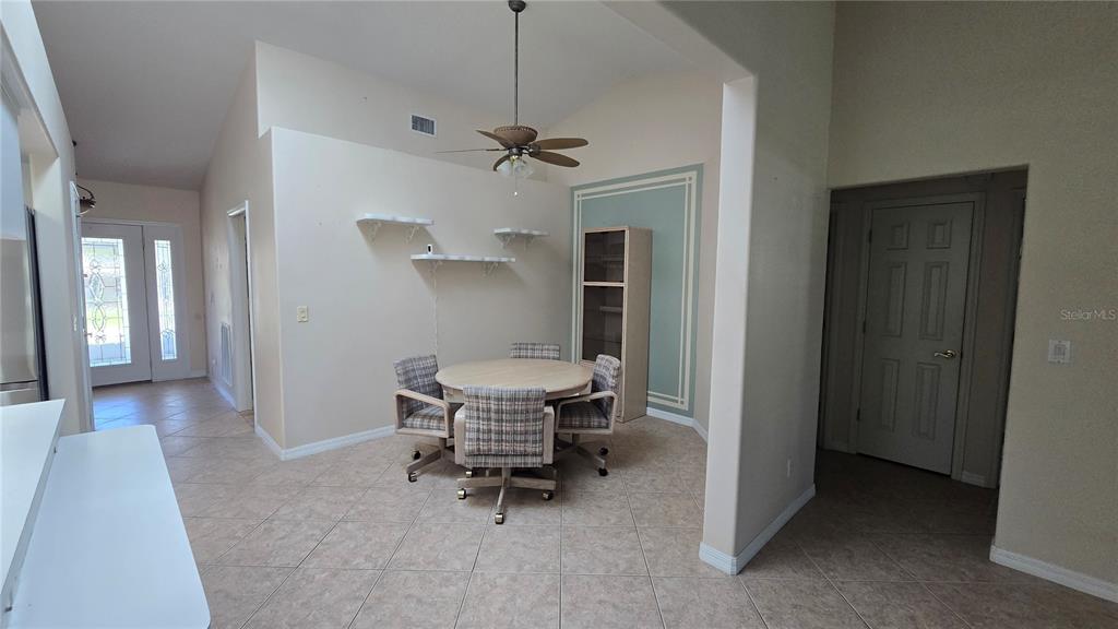 6501 Borg Street Leesburg, FL 34748 - Photo 16 of 59 a view of a hallway with chairs and a table in a room