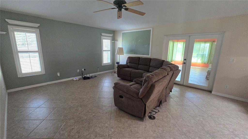 6501 Borg Street Leesburg, FL 34748 - Photo 18 of 59 a living room with furniture and a window
