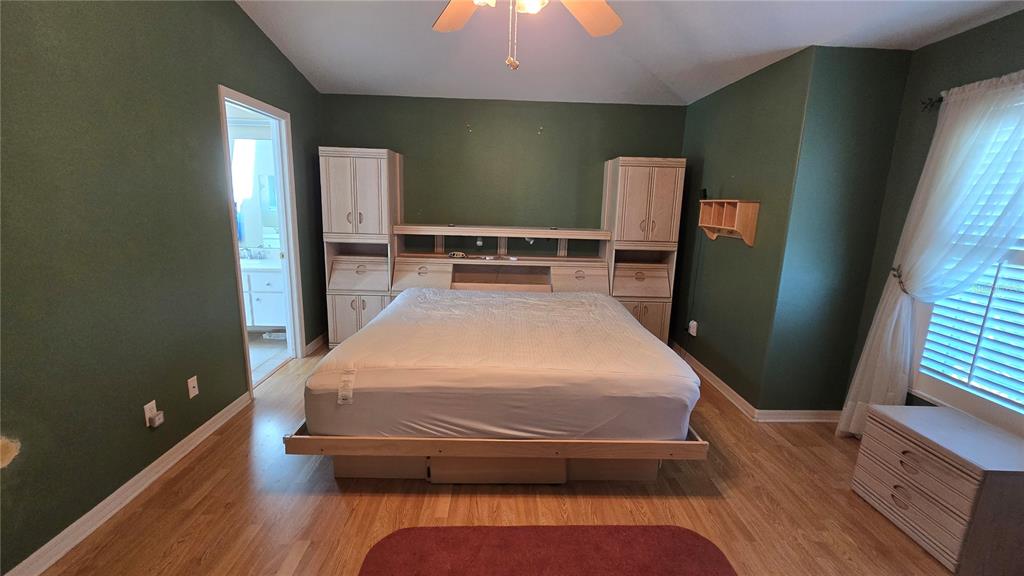 6501 Borg Street Leesburg, FL 34748 - Photo 22 of 59 a bed sitting in a room next to a window