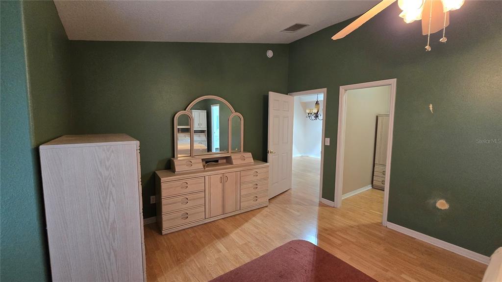 6501 Borg Street Leesburg, FL 34748 - Photo 24 of 59 a spacious bathroom with a double vanity sink and mirror