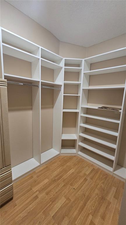 6501 Borg Street Leesburg, FL 34748 - Photo 31 of 59 a view of an empty room with wooden floor and a window