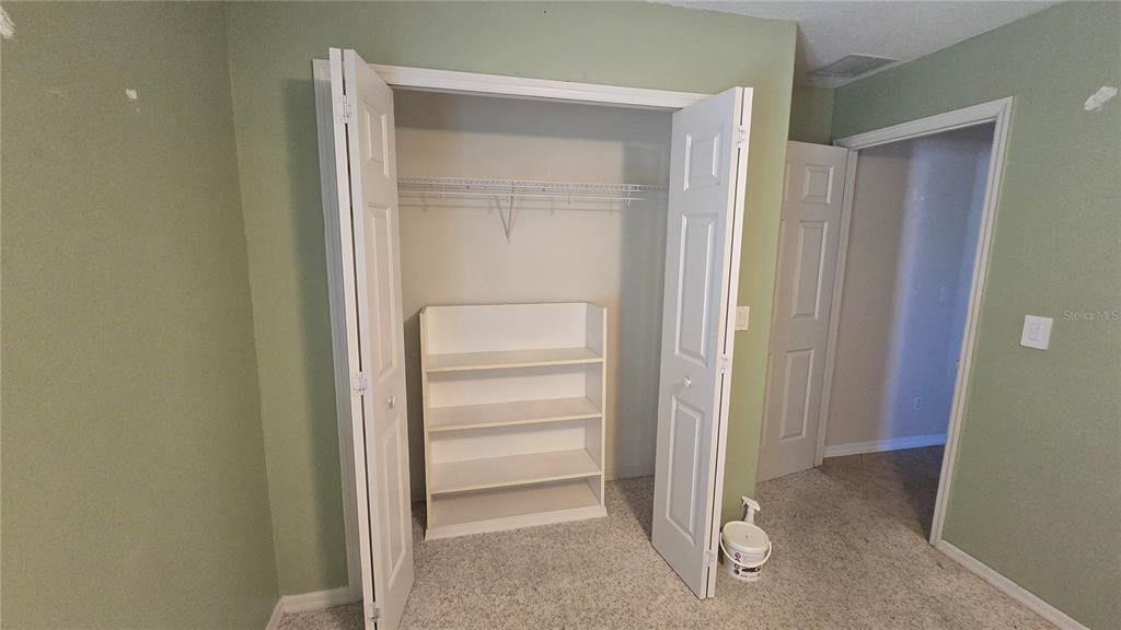 6501 Borg Street Leesburg, FL 34748 - Photo 33 of 59 a view of walk in closet with empty racks