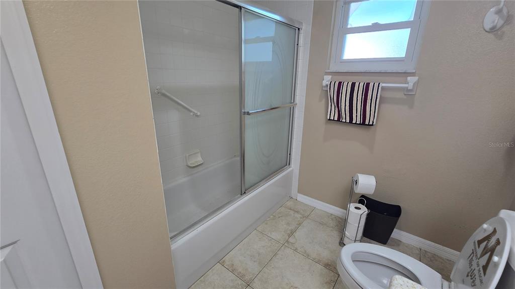 6501 Borg Street Leesburg, FL 34748 - Photo 35 of 59 a bathroom with a toilet and a shower