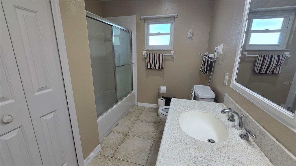 6501 Borg Street Leesburg, FL 34748 - Photo 36 of 59 a bathroom with a sink toilet and shower