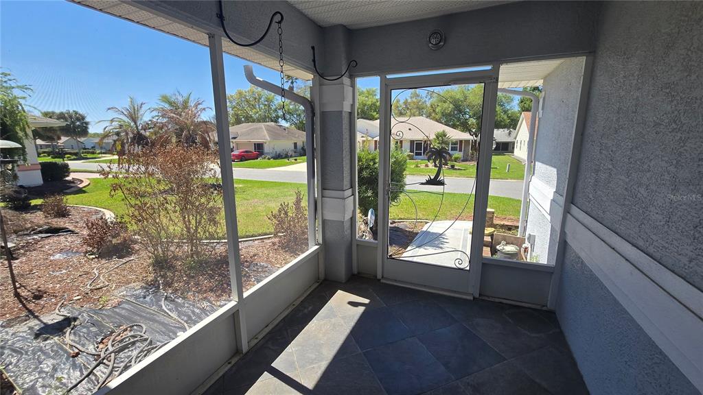 6501 Borg Street Leesburg, FL 34748 - Photo 4 of 59 a view of a porch and a yard