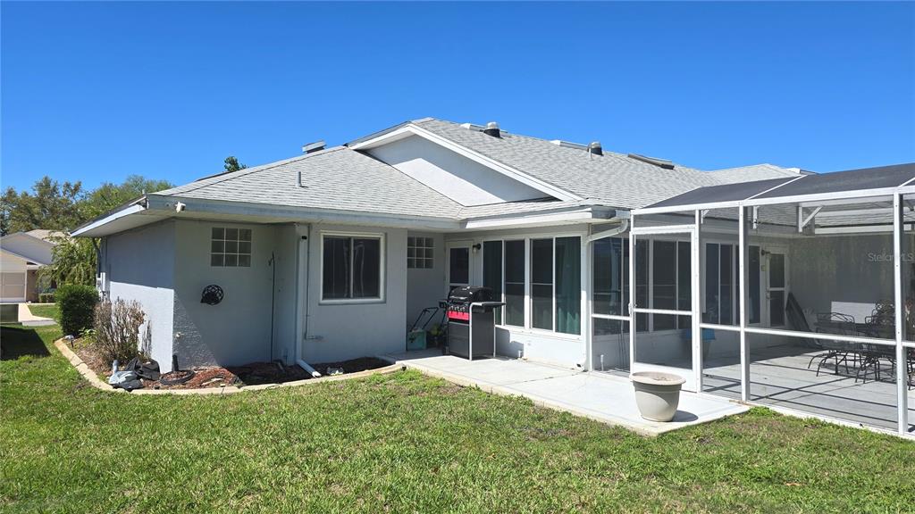 6501 Borg Street Leesburg, FL 34748 - Photo 54 of 59 a view of a house with backyard and porch