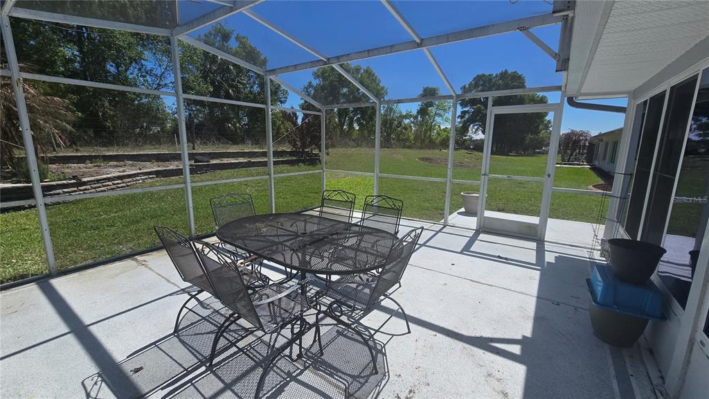 6501 Borg Street Leesburg, FL 34748 - Photo 56 of 59 a view of a chair and tables in the patio