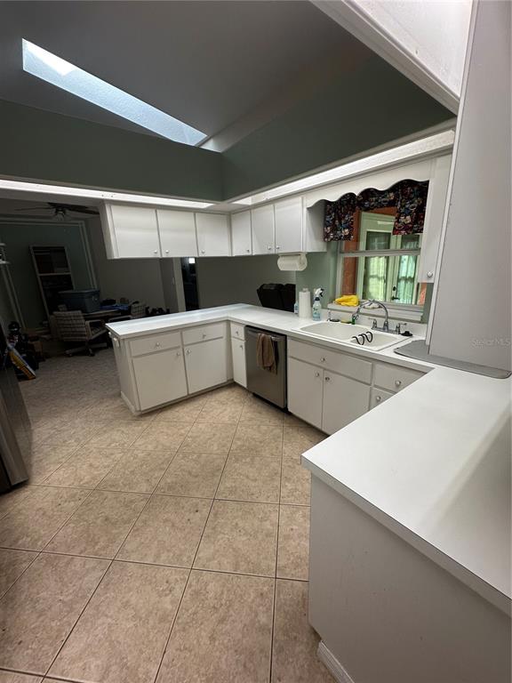 6501 Borg Street Leesburg, FL 34748 - Photo 9 of 59 a kitchen with a sink and a stove top oven