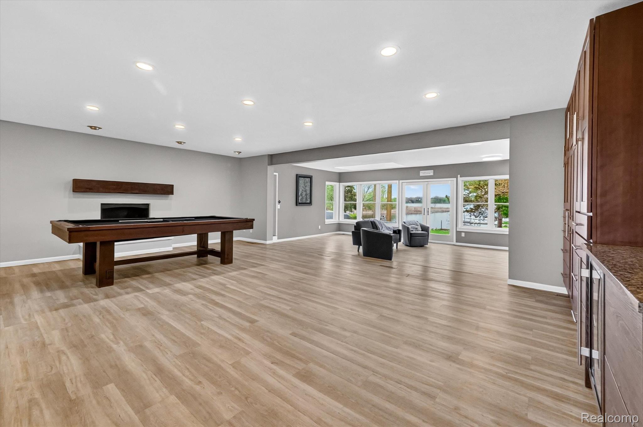 2264 Crane Road Fenton, MI 48430 - Photo 19 of 55 Recreation room with a fireplace, light wood-style flooring, recessed lighting, and billiards
