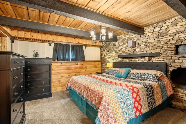 a bedroom with a bed and a mirror