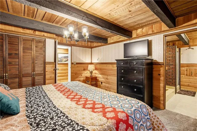 a bedroom with a bed and a television