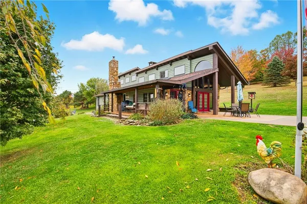 a view of a house with a backyard