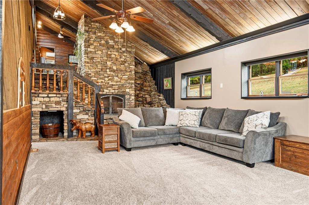 147 Weyant Road White, PA 15490 - Photo 8 of 47 a living room with furniture a fireplace and a chandelier