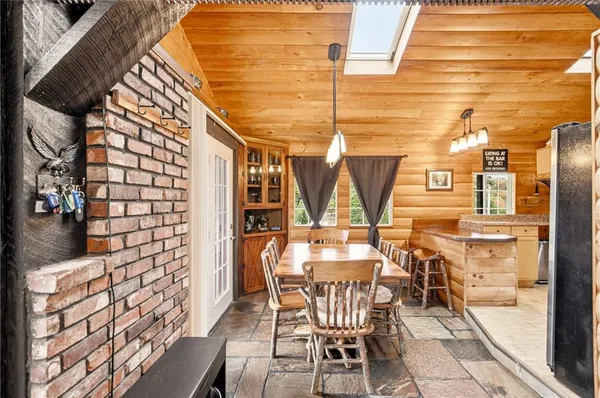 a view of a patio with table and chairs and potted plants