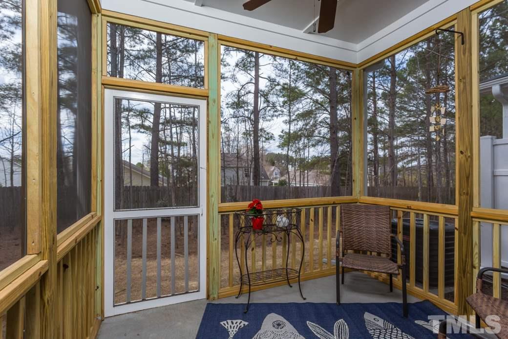 2458 Pecan Ridge Way Apex, NC 27502 - Photo 13 of 14 Enjoy quiet evenings or early morning coffee in your private screened porch.