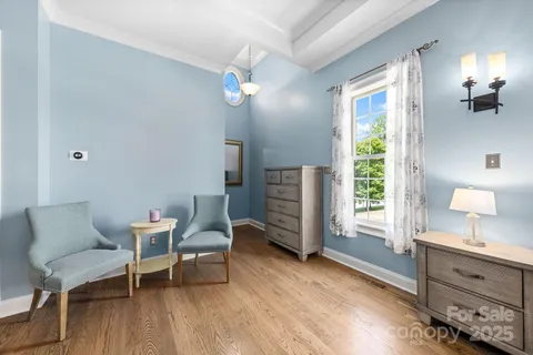 a bedroom with a bed and a tv