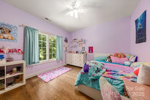 a view of a workspace with furniture and a bedroom