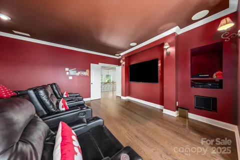 a bed room with a bed and a chandelier