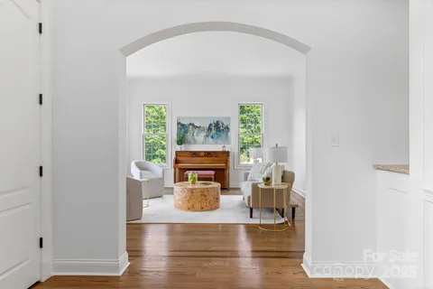a view of a livingroom with furniture and a window