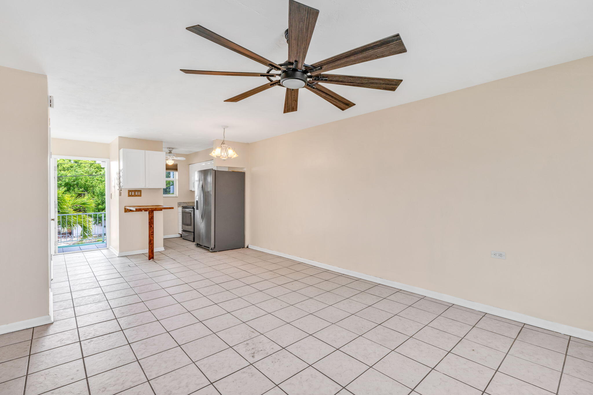 5301 Ocean Terrace, Unit 6 Marathon, FL 33050 - Photo 16 of 38 a view of a livingroom with a ceiling fan and window
